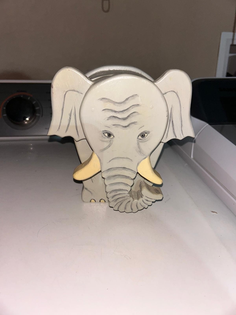 a vintage, handcrafted wood block elephant figurine.